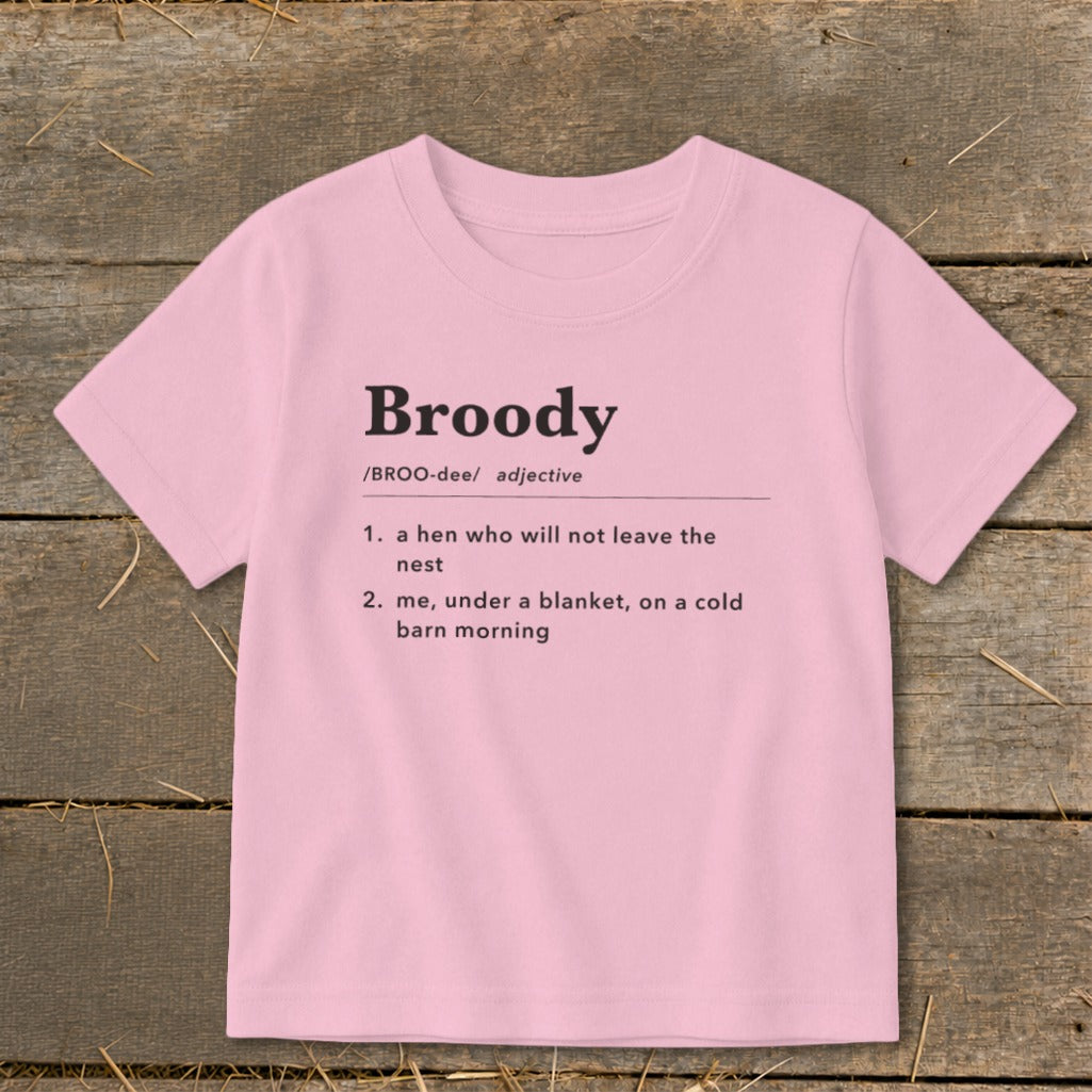 Pink t-shirt with the definition of "Broody" printed on it.