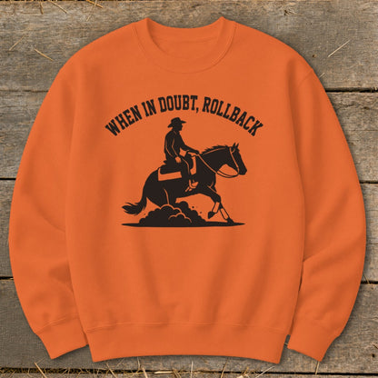 Orange sweatshirt with black graphic of a cowboy on a horse and text "When in doubt, rollback".