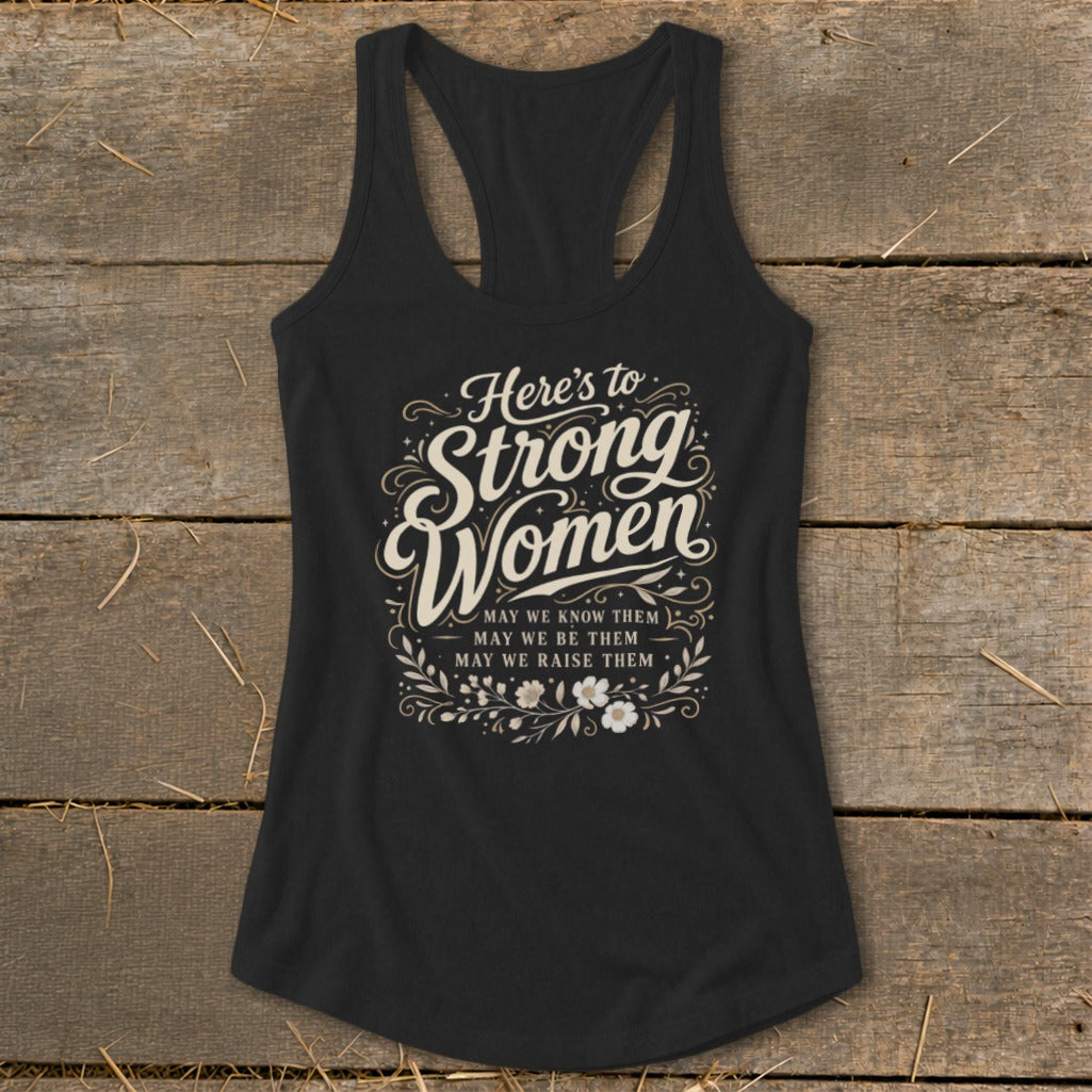 Black racerback tank top with "Here's to Strong Women" text and floral design.