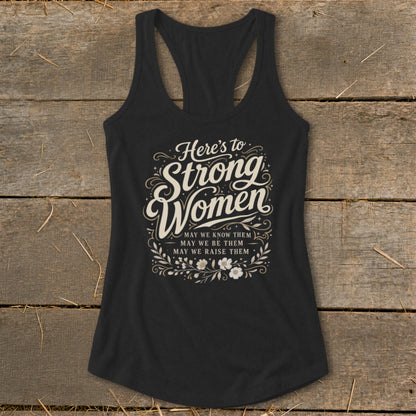 Black racerback tank top with "Here's to Strong Women" text and floral design.