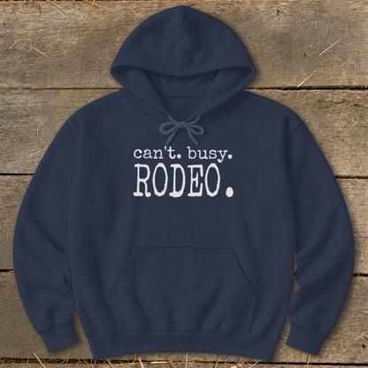 Navy hoodie with white text "can't. busy. RODEO." on chest.
