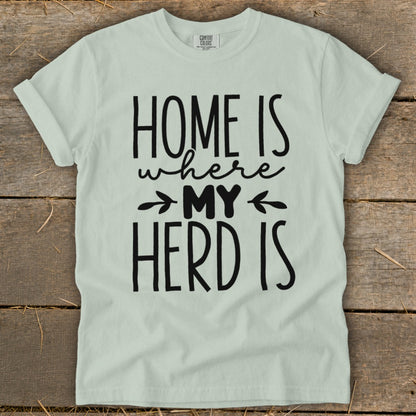 Light green t-shirt with black text reading "HOME IS where MY HERD IS."