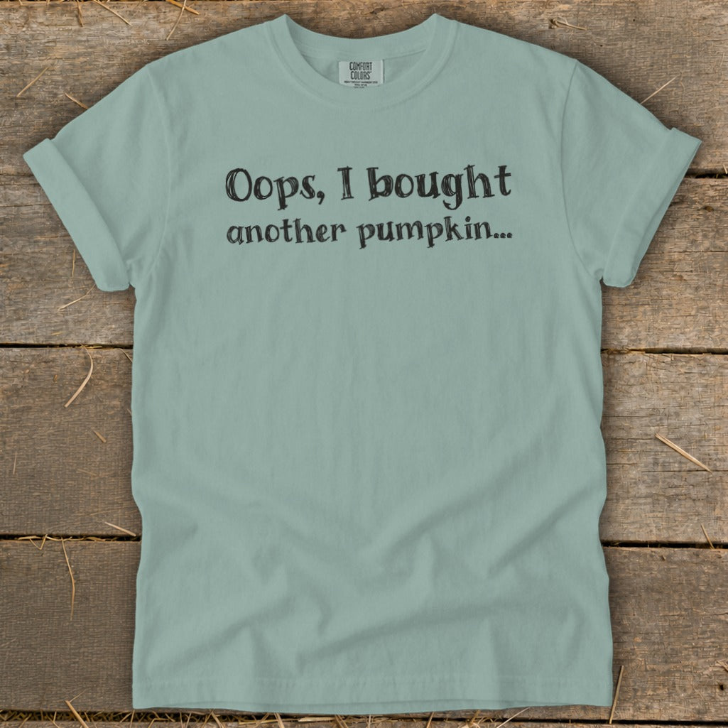 Light teal t-shirt with "Oops, I bought another pumpkin..." text.