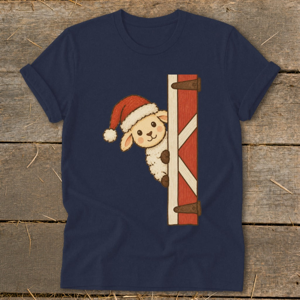 Sheep wearing Santa hat peeking around a barn door on a navy blue shirt.