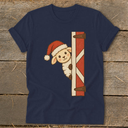 Sheep wearing Santa hat peeking around a barn door on a navy blue shirt.