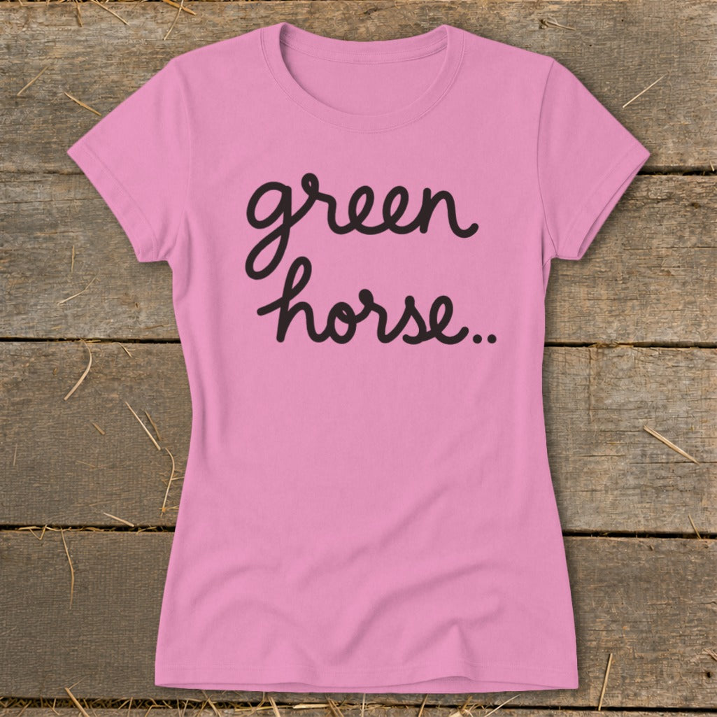 Pink t-shirt with "green horse.." text in black cursive font.