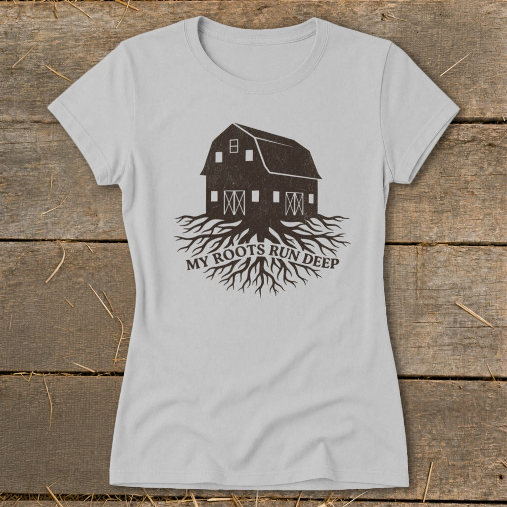 Light gray t-shirt with dark barn and roots graphic, text "MY ROOTS RUN DEEP".