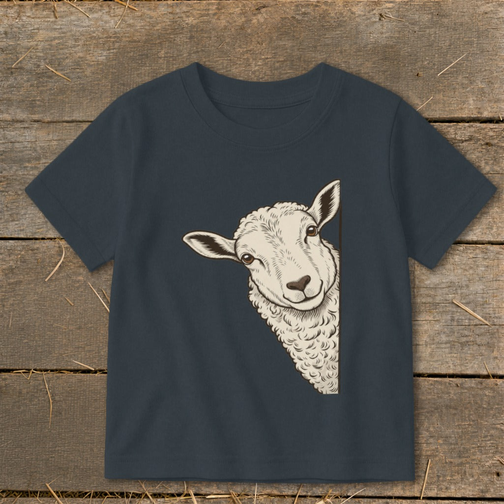 Dark t-shirt with a graphic of a sheep peeking from the side.
