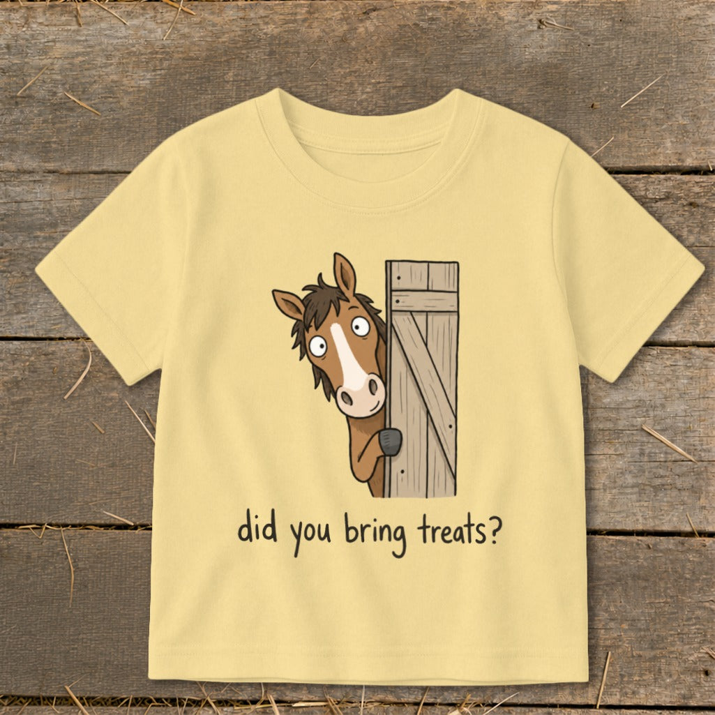 Yellow t-shirt with cartoon horse peeking around a gate asking "did you bring treats?".