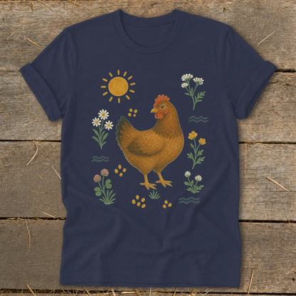 Dark blue t-shirt with a brown chicken illustration surrounded by sun, flowers, and seeds.