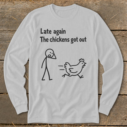 White long-sleeve shirt with text "Late again The chickens got out" and stick figure chasing a chicken.