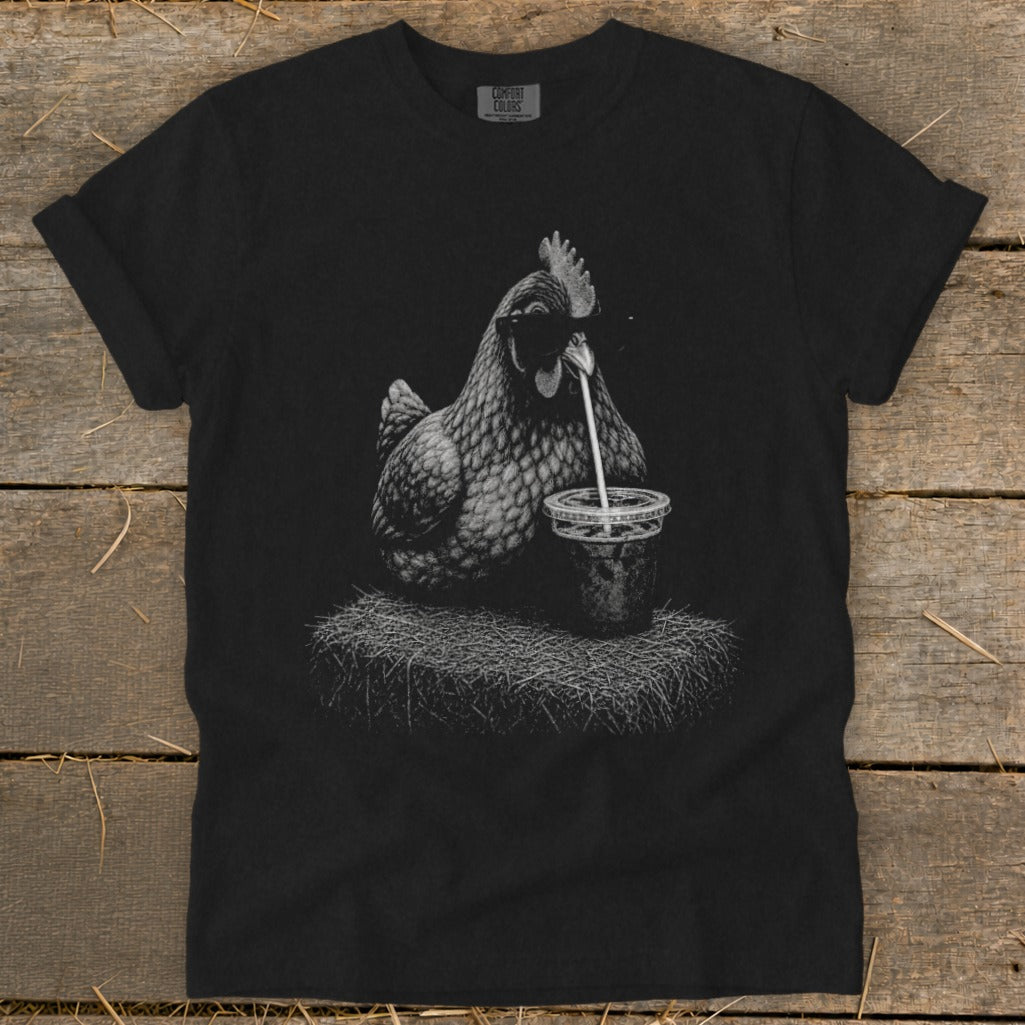 Black t-shirt with illustration of a chicken wearing sunglasses drinking from a cup.