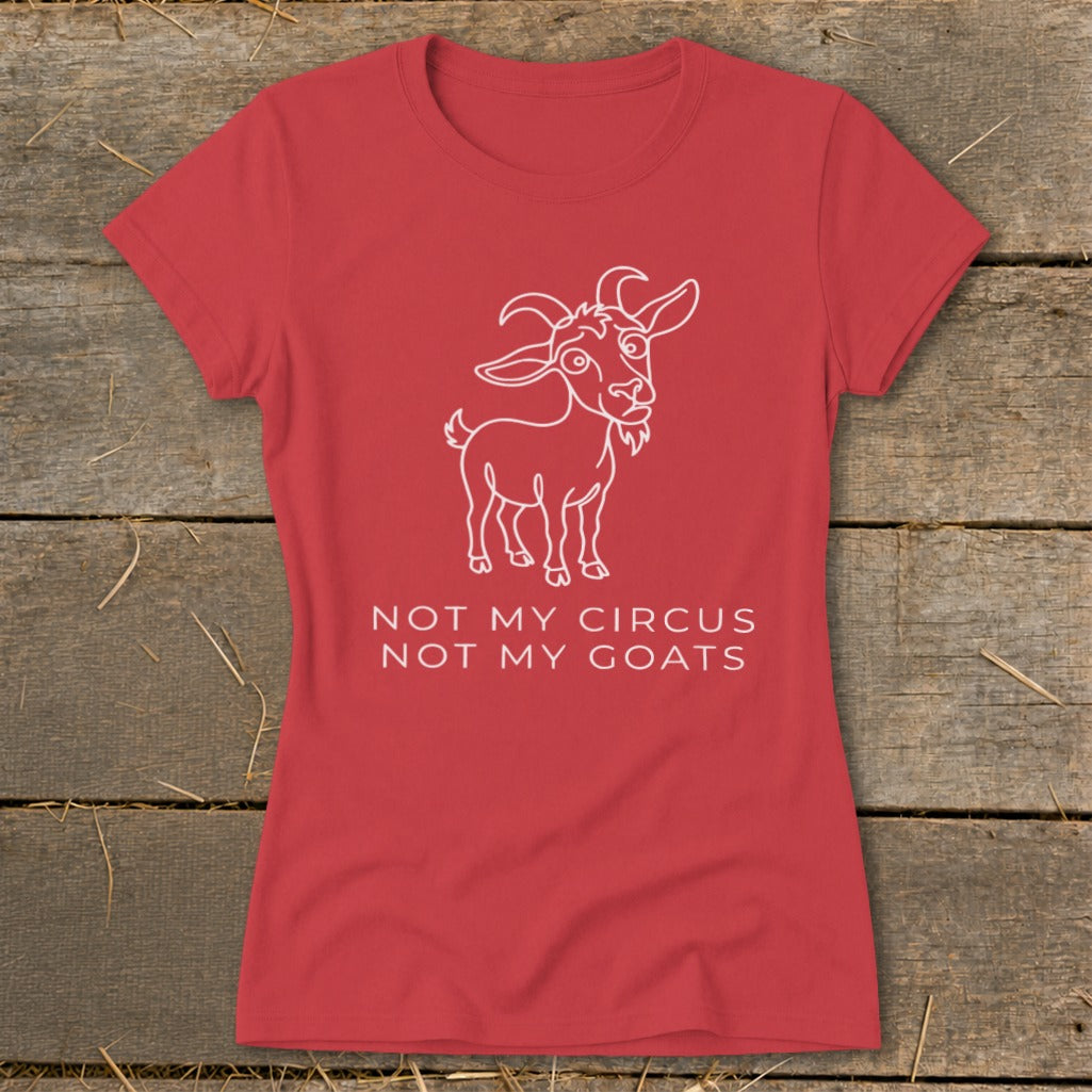 Red t-shirt with a white line drawing of a goat and text reading "NOT MY CIRCUS NOT MY GOATS".