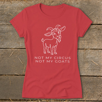 Red t-shirt with a white line drawing of a goat and text reading "NOT MY CIRCUS NOT MY GOATS".