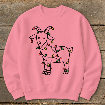 Pink sweatshirt with a black outline drawing of a goat wrapped in Christmas lights.