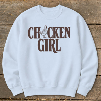 Light blue crewneck sweatshirt with brown "CHICKEN GIRL" text and chicken graphic.