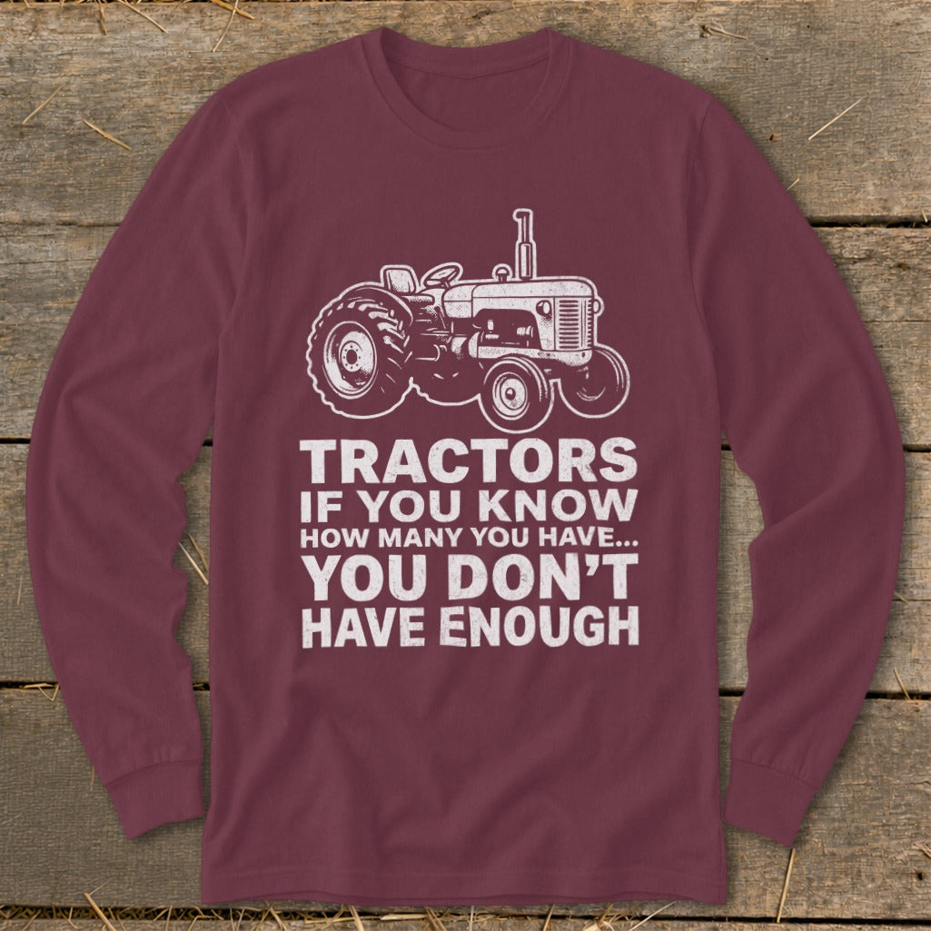 Maroon long sleeve shirt with white tractor graphic and text.