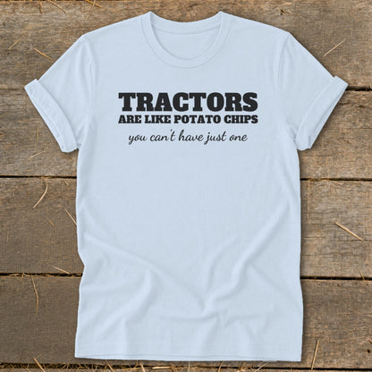 Light blue t-shirt with black text: "Tractors are like potato chips you can't have just one."