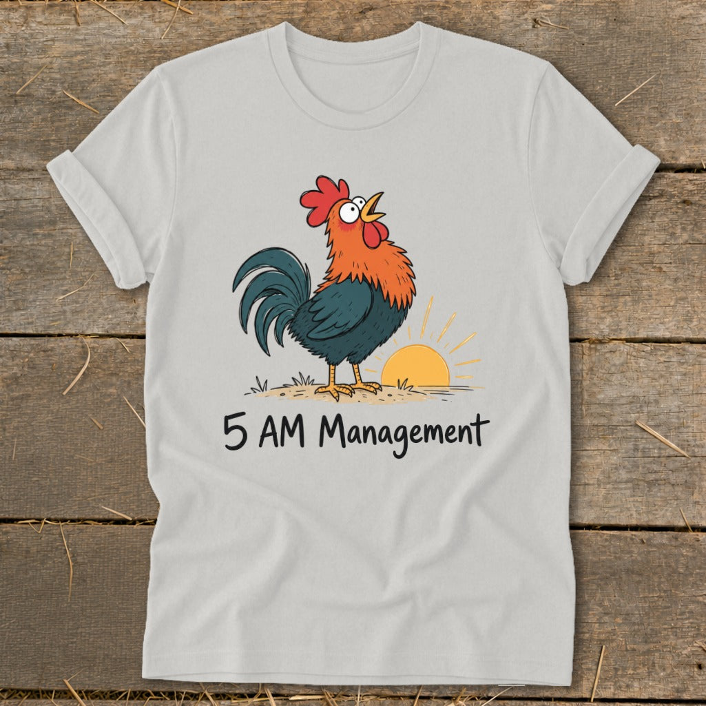 White t-shirt with cartoon rooster crowing at sunrise and text "5 AM Management."