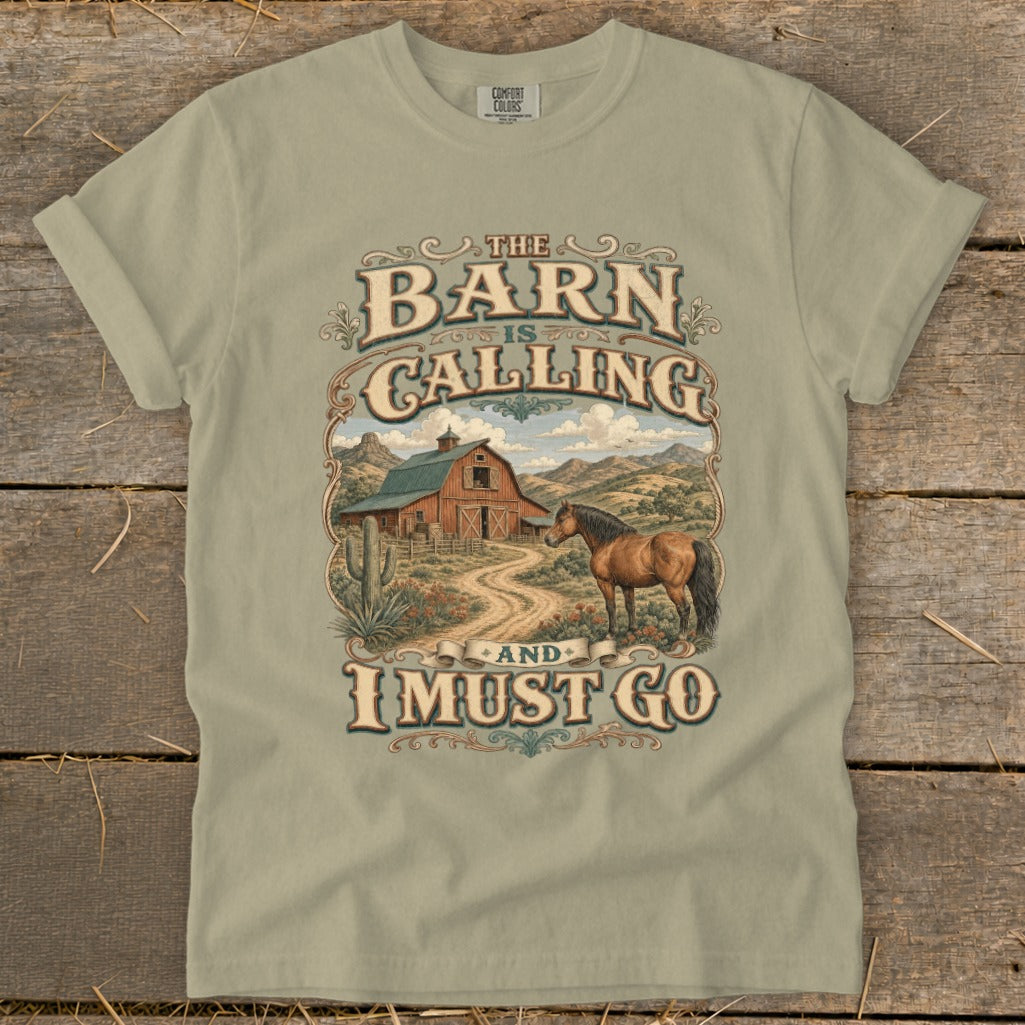 T-shirt graphic with "The Barn is Calling and I Must Go" text and rural scene.