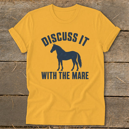 Yellow t-shirt with navy blue text "DISCUSS IT WITH THE MARE" and horse silhouette.