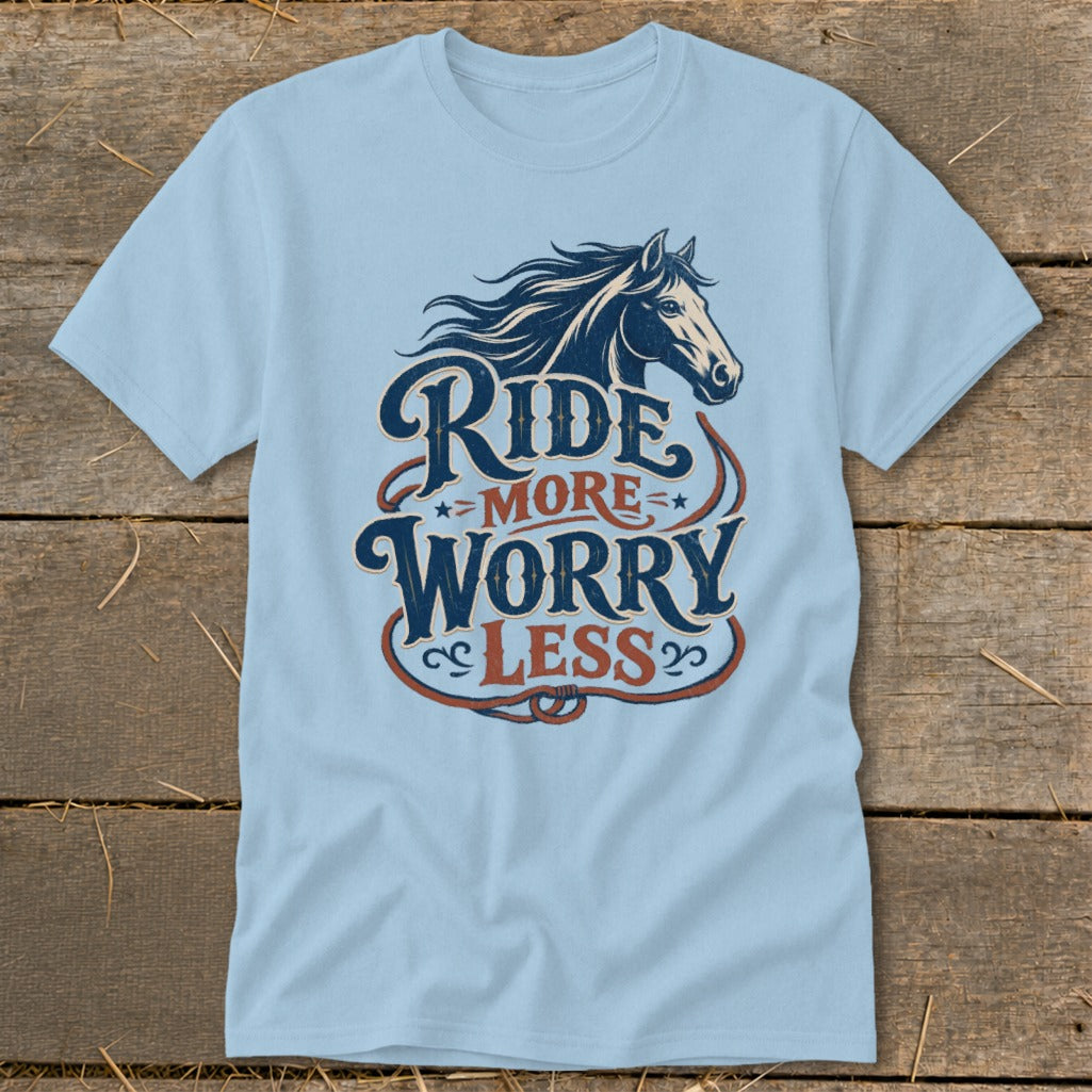 Light blue t-shirt with vintage horse graphic and text "Ride More Worry Less".