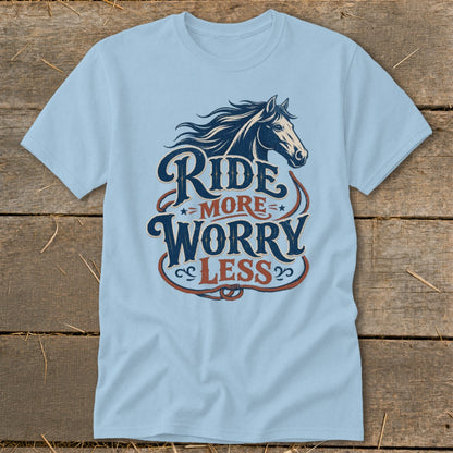 Light blue t-shirt with vintage horse graphic and text "Ride More Worry Less".