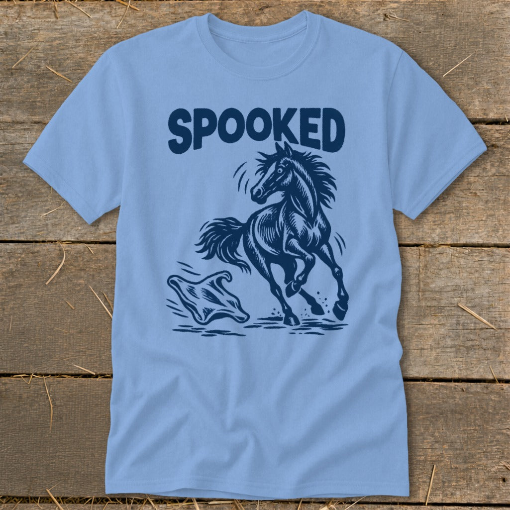 Light blue t-shirt with "SPOOKED" text above a startled horse and a ghost.