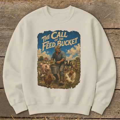 Crewneck sweatshirt featuring a farmer with a feed bucket surrounded by farm animals and text "The Call of the Feed Bucket."