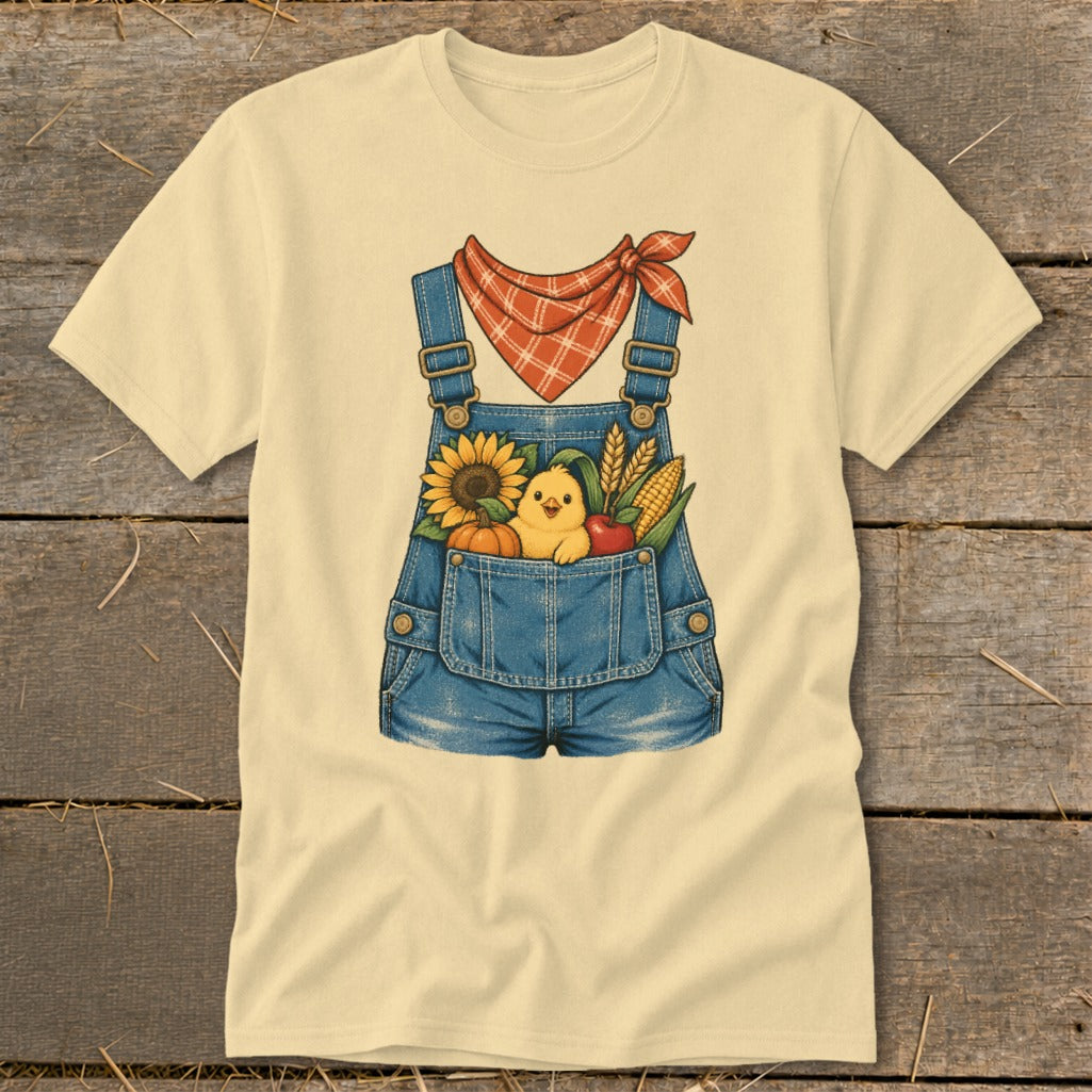Yellow t-shirt with a denim overalls graphic featuring a chick, sunflower, pumpkin, corn, and apple.