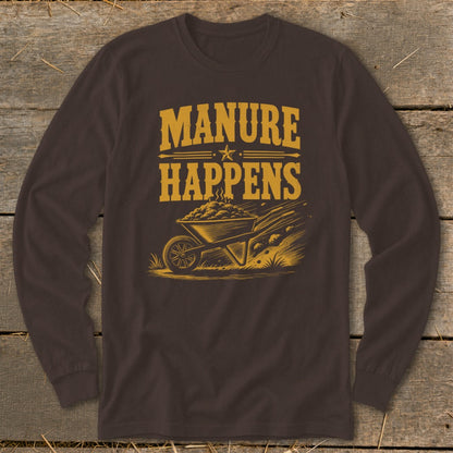 Brown long-sleeve shirt with yellow text "Manure Happens" and wheelbarrow graphic.