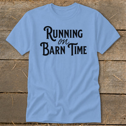 Light blue t-shirt with "Running on Barn Time" text in black script font.