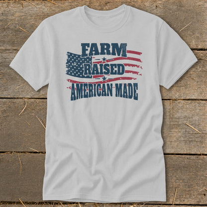 White t-shirt with distressed American flag graphic and text "FARM RAISED AMERICAN MADE".