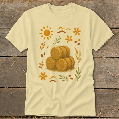 Light yellow t-shirt with a rustic harvest-themed graphic featuring hay bales and autumn accents.