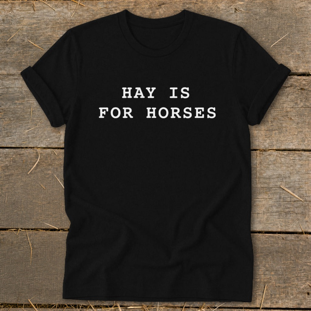 Black t-shirt with white text that reads "HAY IS FOR HORSES".