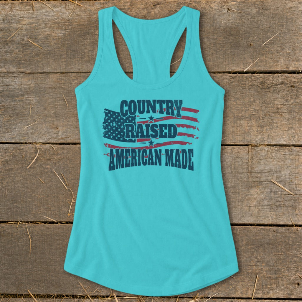 Teal tank top with "Country Raised American Made" text and distressed American flag graphic.