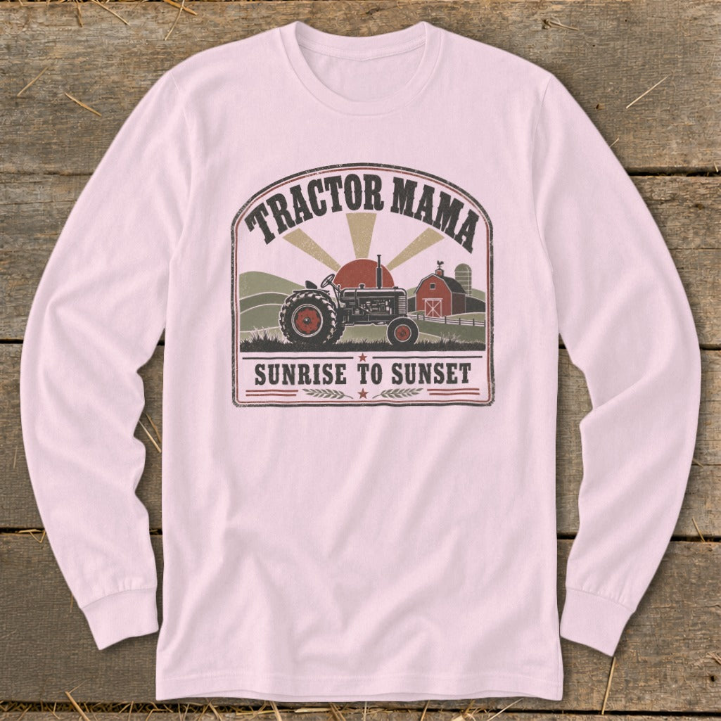 Tractor Mama graphic on pink long-sleeve shirt with tractor, barn, and text.