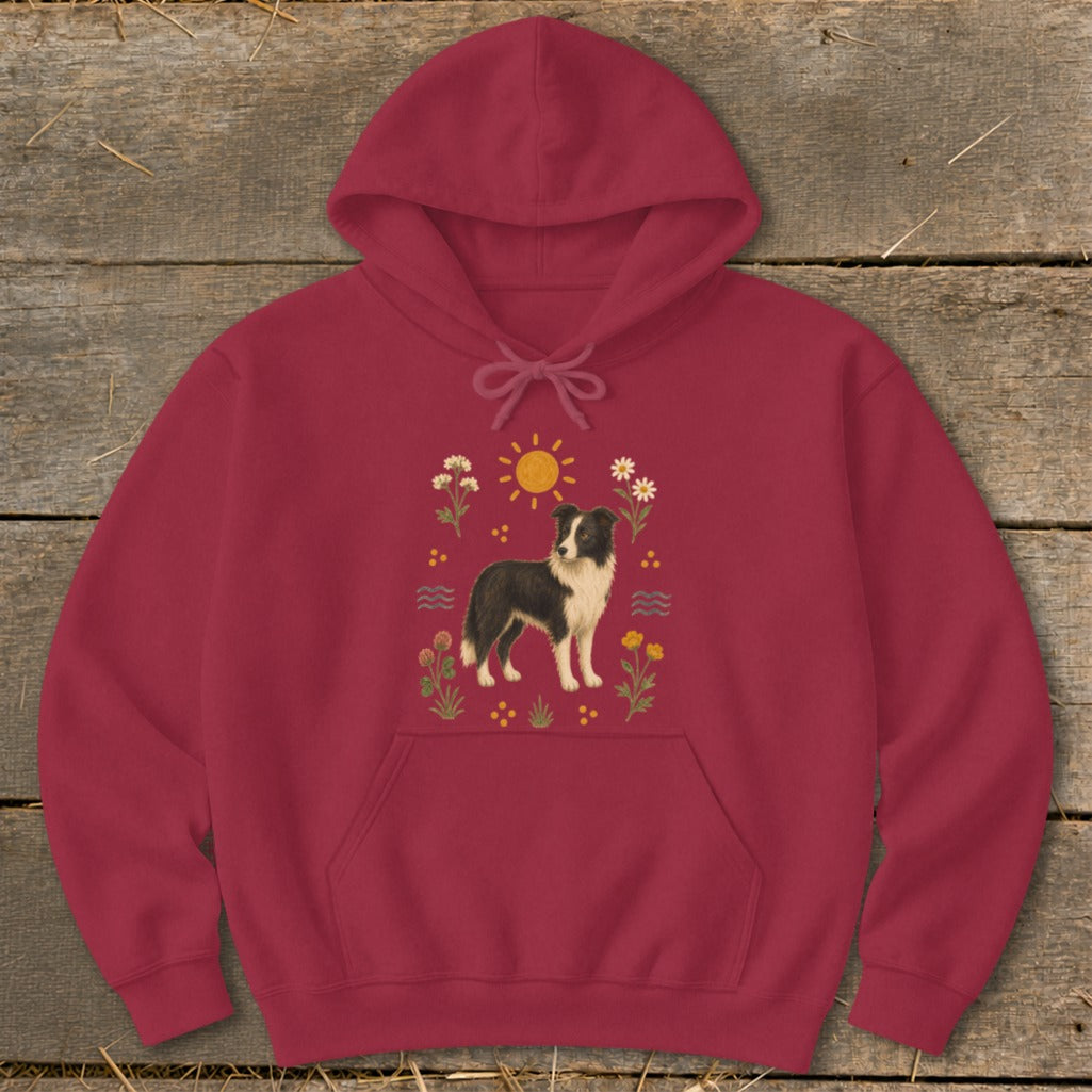 Maroon hoodie with a Border Collie illustration surrounded by flowers and a sun.