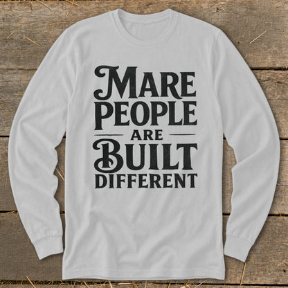 White long-sleeve shirt with black text: "Mare People Are Built Different".