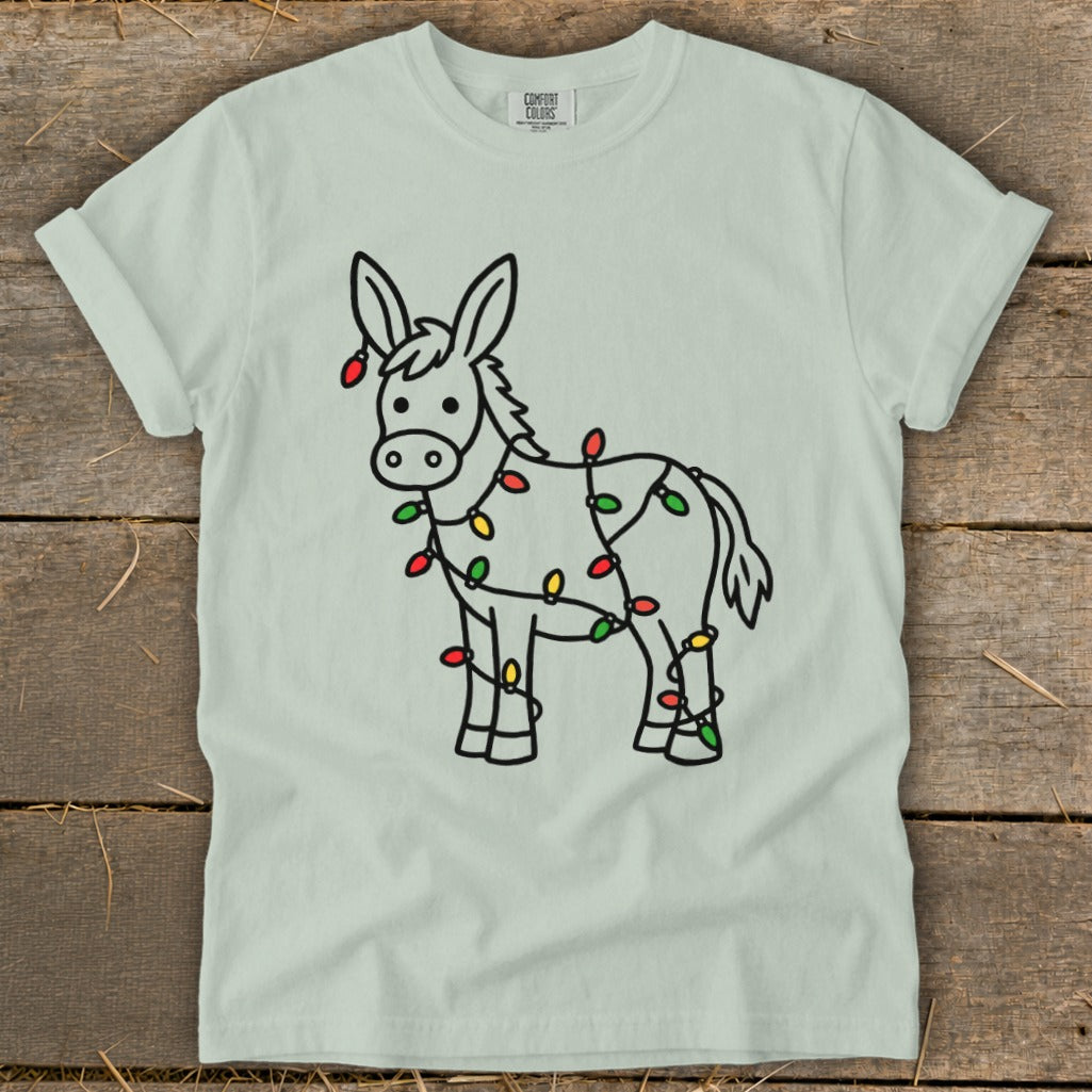 Donkey silhouette wrapped in colorful Christmas lights on a light green t-shirt.