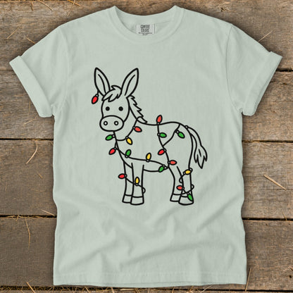 Donkey silhouette wrapped in colorful Christmas lights on a light green t-shirt.