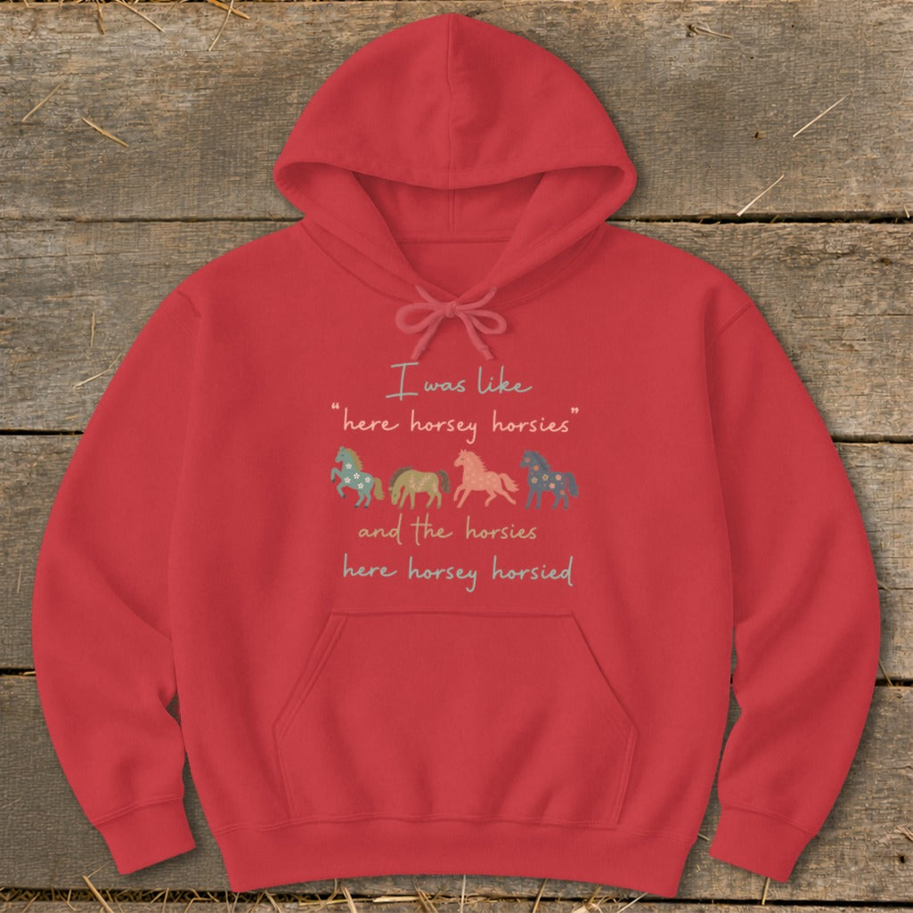 Red hoodie with text and four colorful horse graphics.