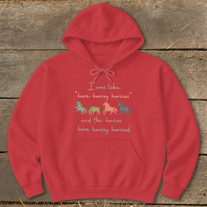 Red hoodie with text and four colorful horse graphics.