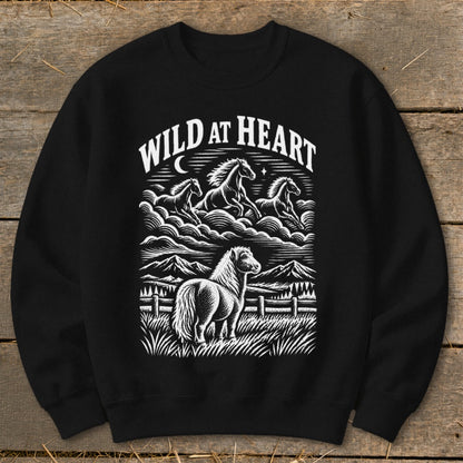 Black sweatshirt with "Wild at Heart" graphic of horses and mountains.