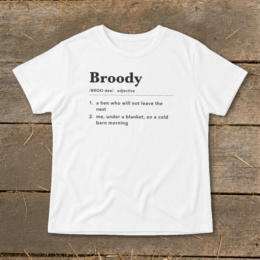 White t-shirt with "Broody" definition: "a hen who will not leave the nest" and "me, under a blanket".