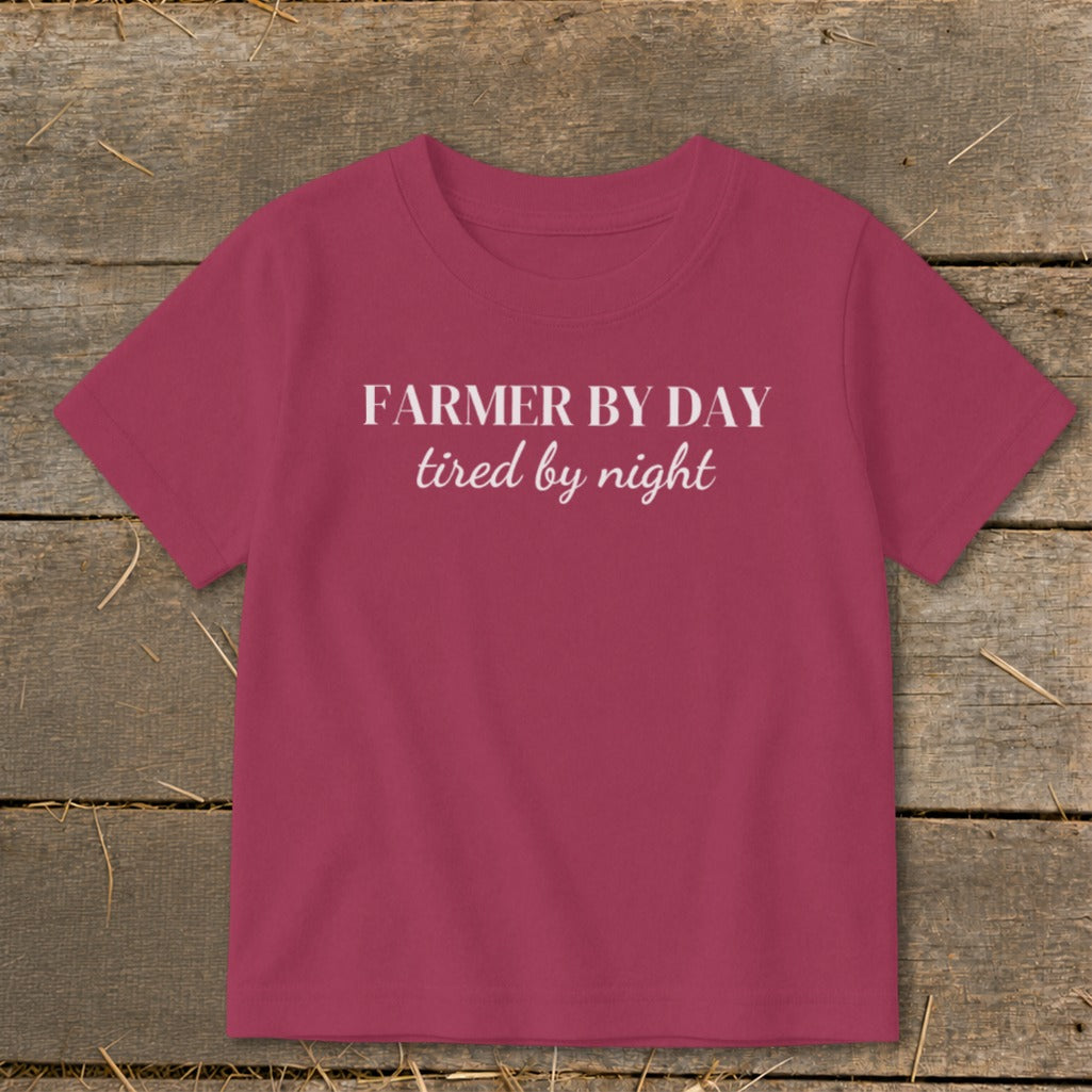 Maroon t-shirt with white text "FARMER BY DAY tired by night."