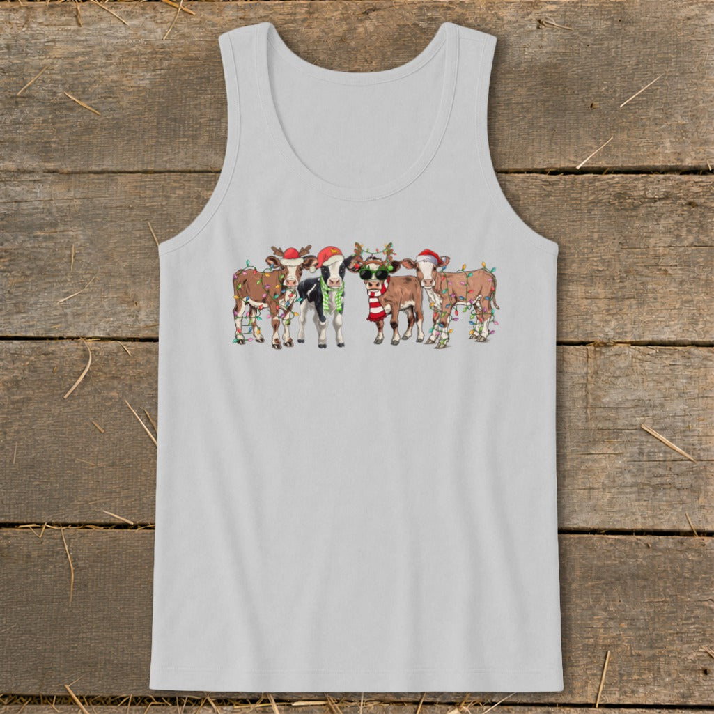 Five cows wearing Santa hats and Christmas lights, one wearing sunglasses.