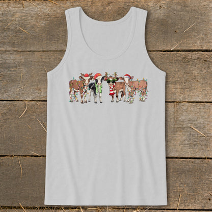 Five cows wearing Santa hats and Christmas lights, one wearing sunglasses.
