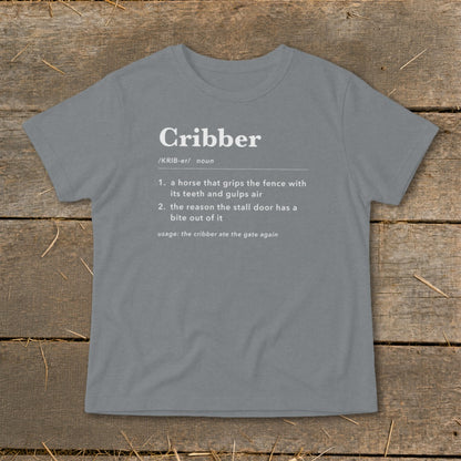 A grey t-shirt featuring humorous dictionary definitions of the word cribber displayed on the chest.
