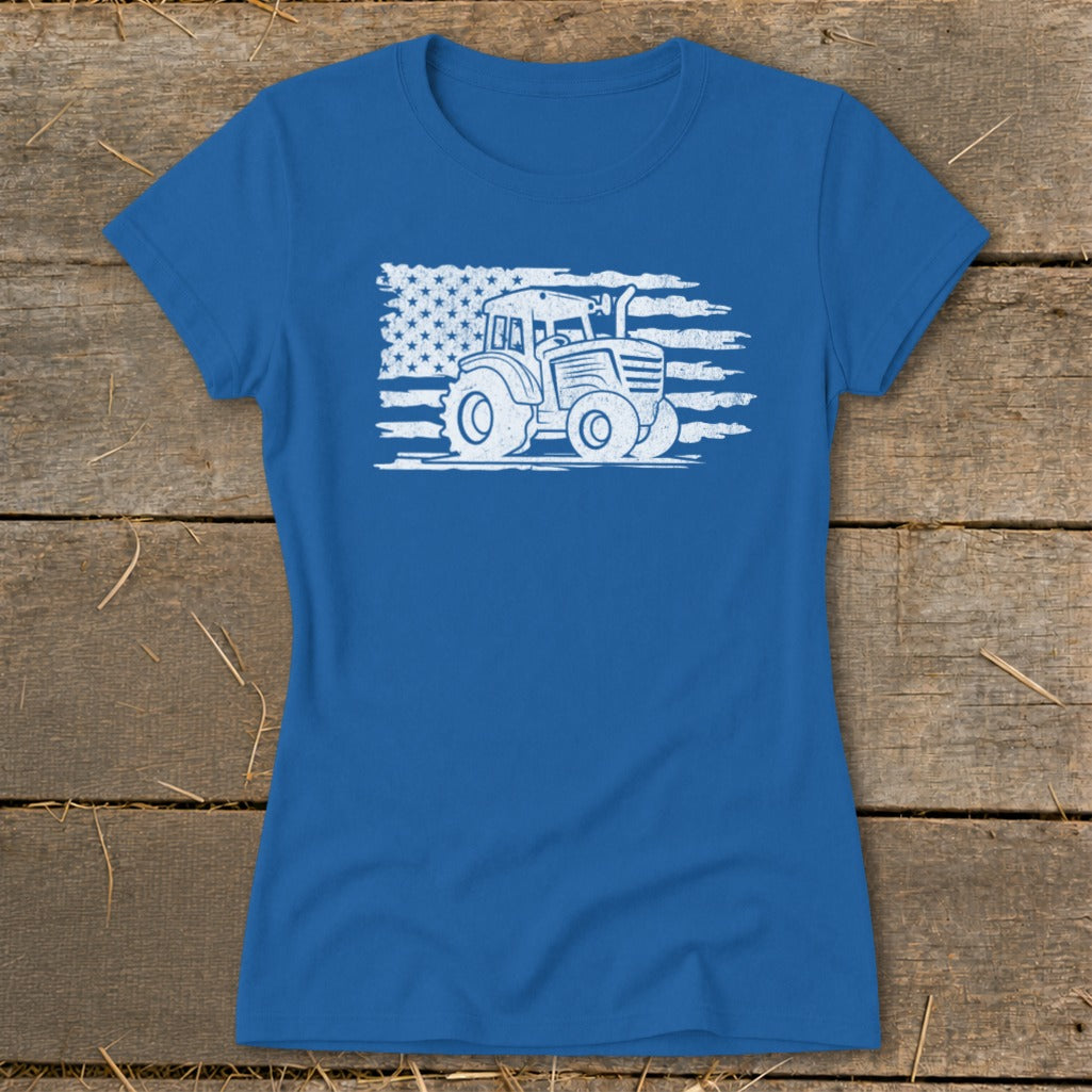 Blue t-shirt featuring a distressed American flag with a tractor graphic.